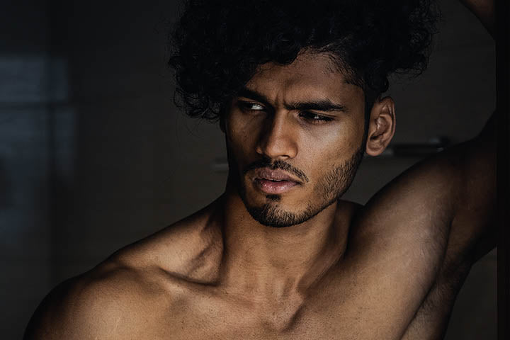bearded man with curly hair style