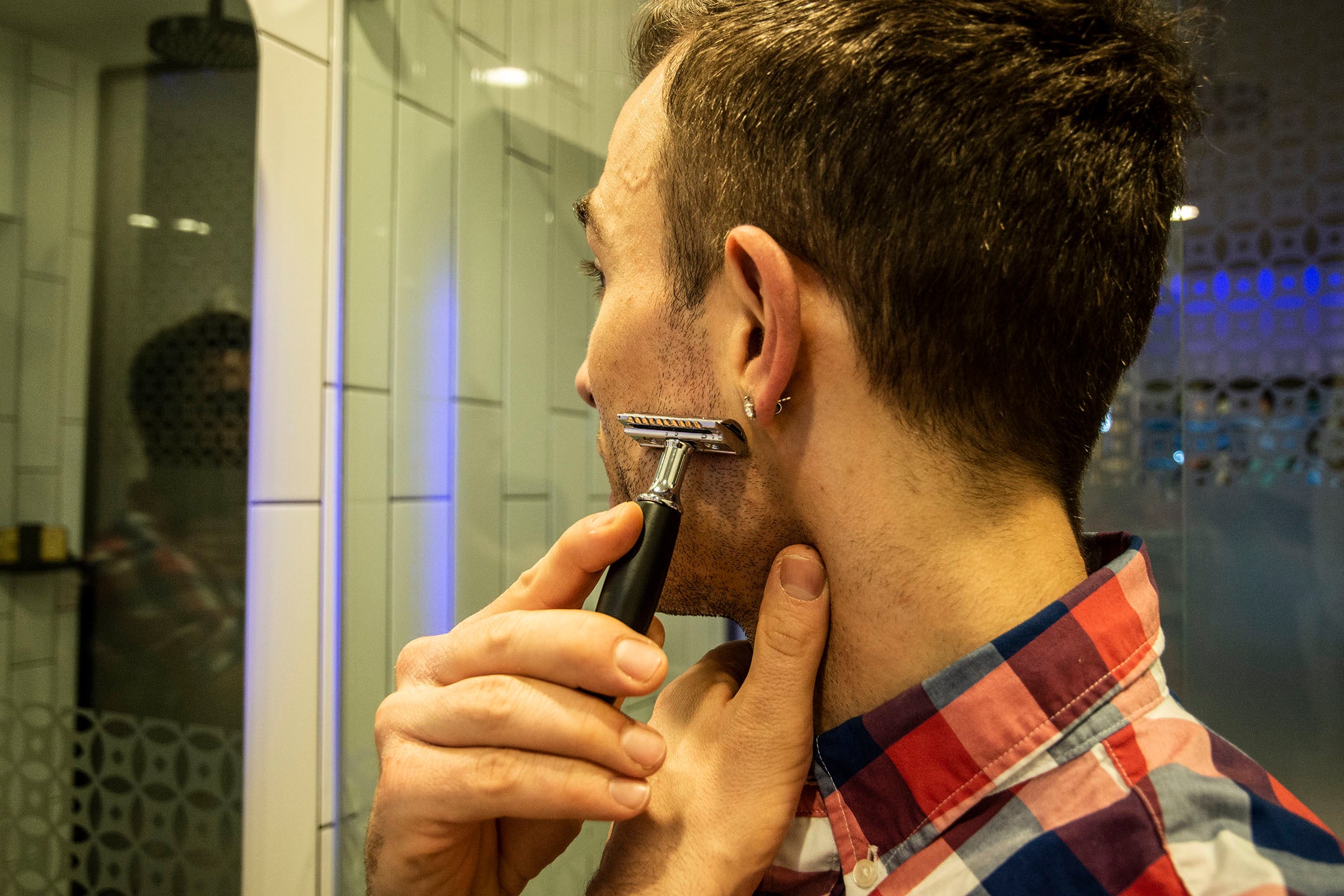 man shaving with cartridge razor