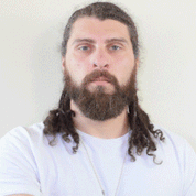 man using the best beard oil