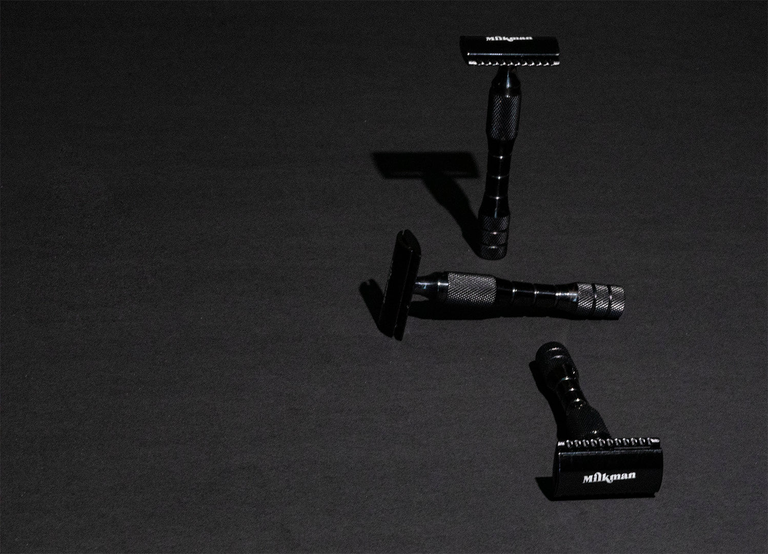 black double edge safety razor from 3 angles