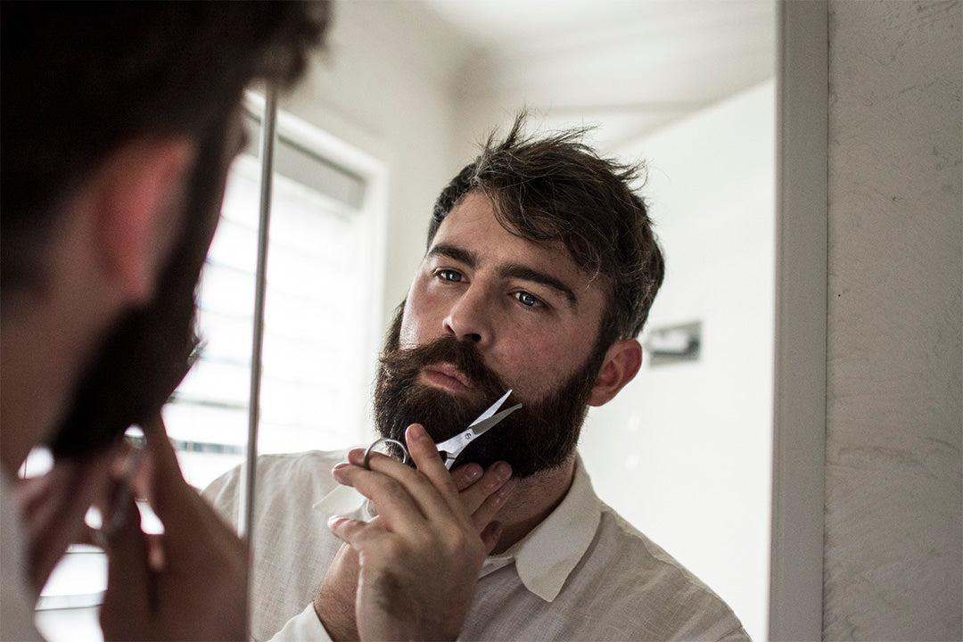 trimming beard with scissors