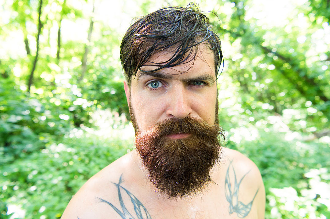 bearded man with oily hair