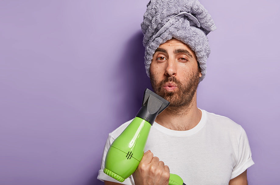 man with bamboo towel and hair dryer