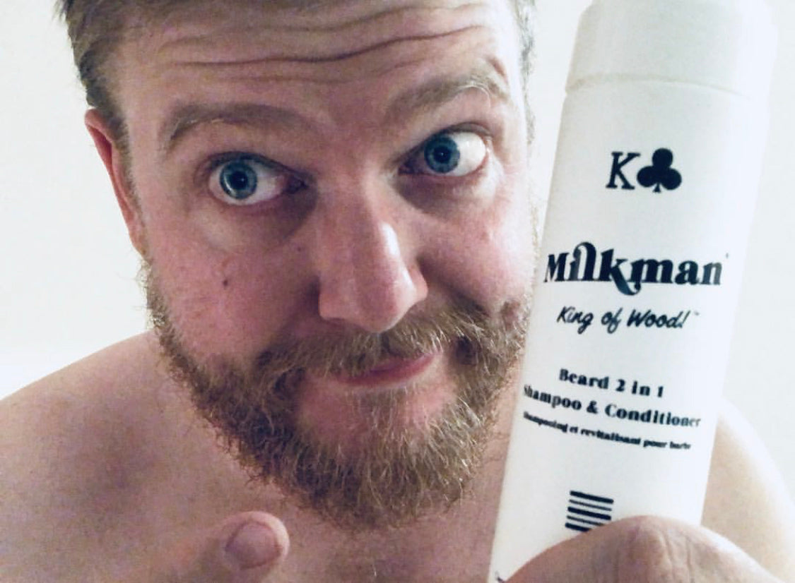 man softening his beard with milkman beard wash