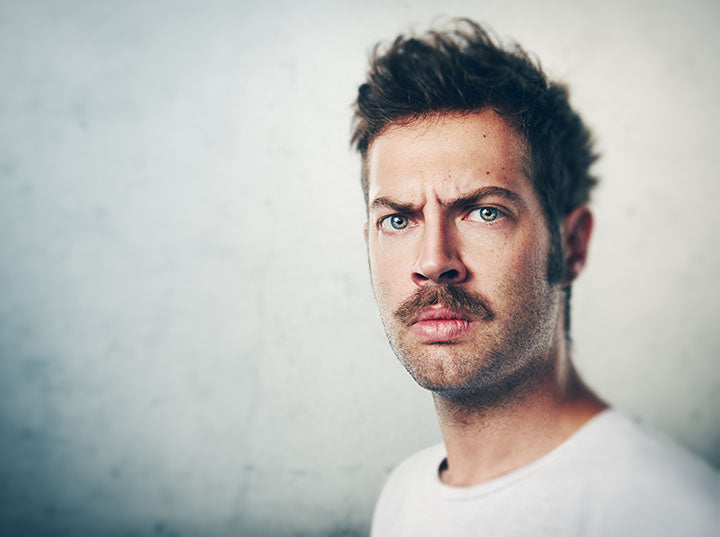 man wondering which moustache style will suit him