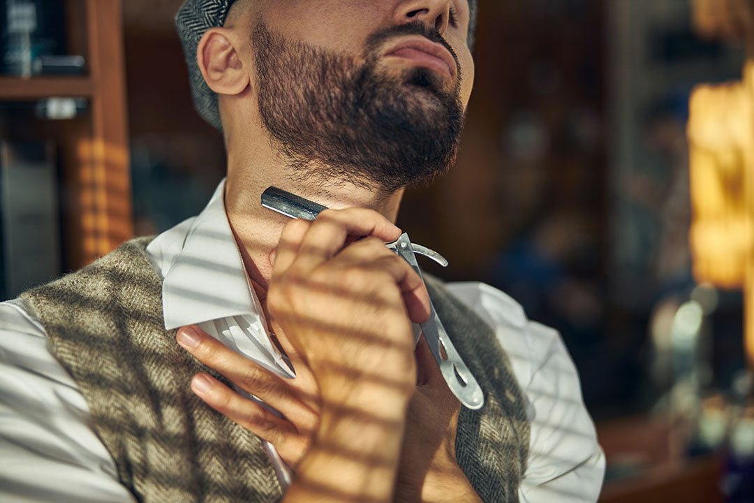 bearded man shaving neckline