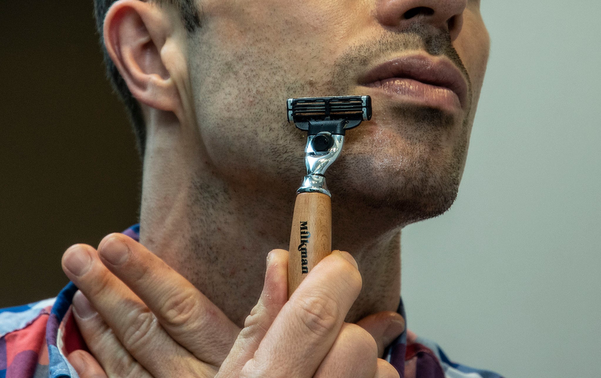 man shaving with milkman safety razor