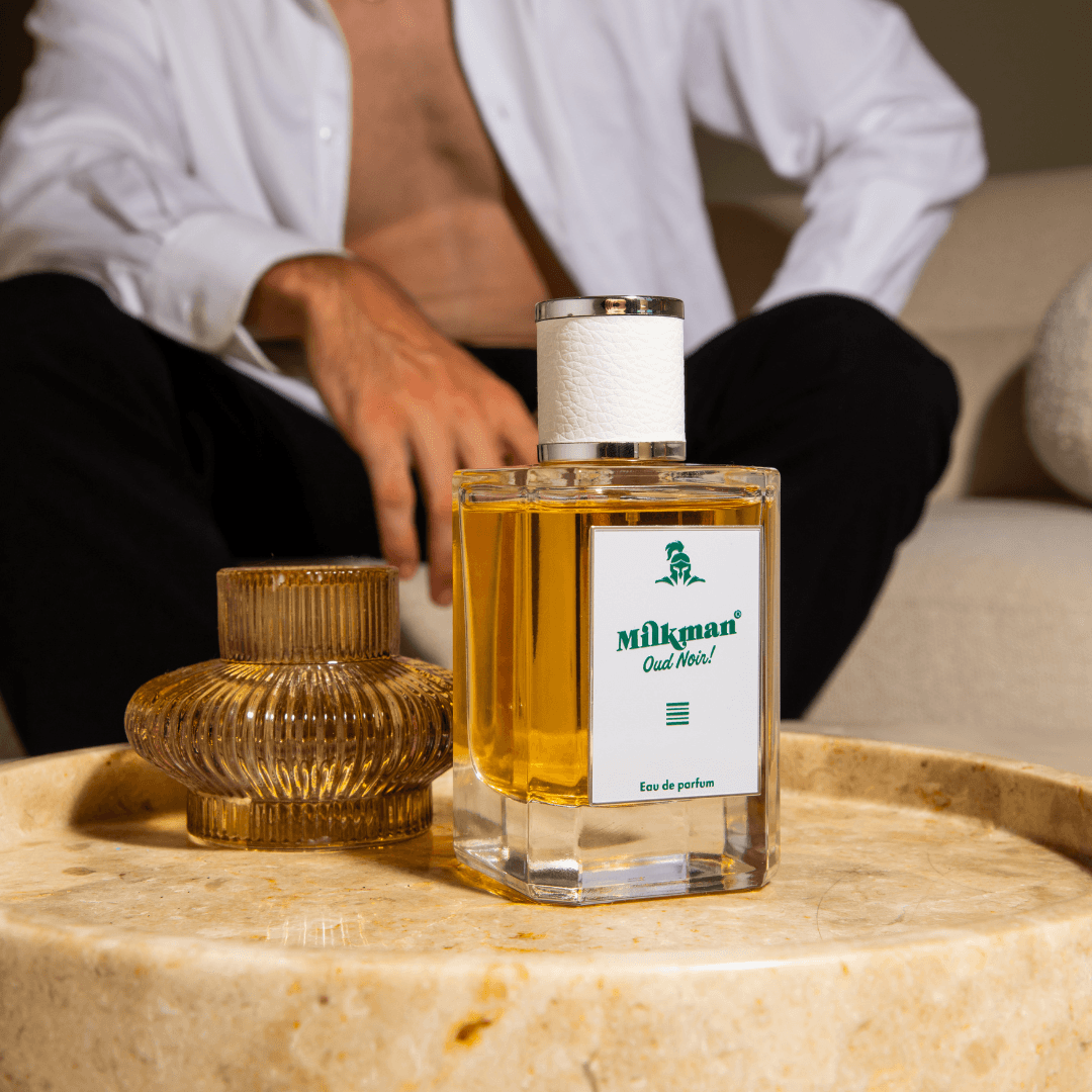 milkman-cologne-men-oud-noir-sitting-on-marble.png